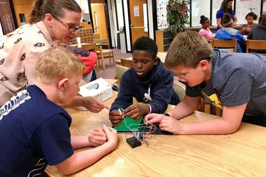 Children building a robot